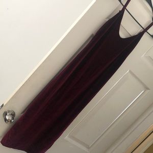 A velvet maroon colored spaghetti strapped dress.